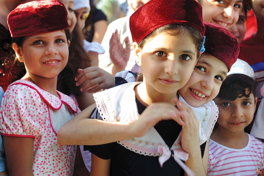 Pretty young Parsi girls, looking like budding air hostesses for Iran Air, outside the Iranshah Atash Behram in Udvada
